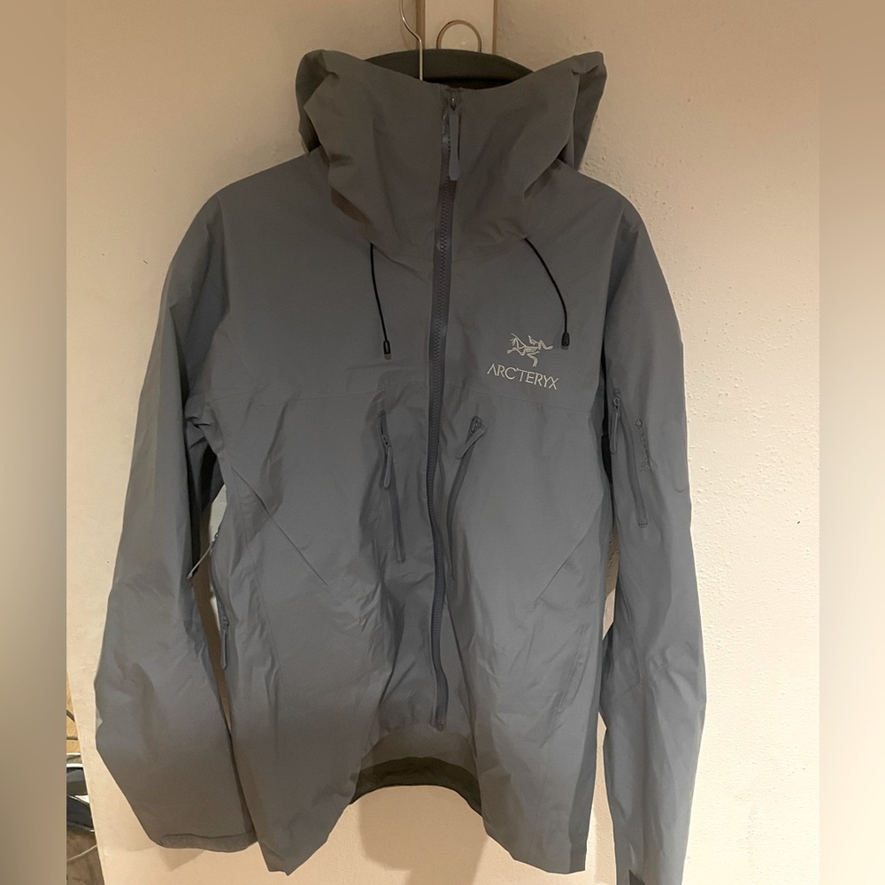 Arc’teryx hard shell rain jacket fairly new used a dozen times